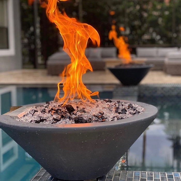 The Outdoor Plus Cazo Concrete Fire Bowl beside a pool