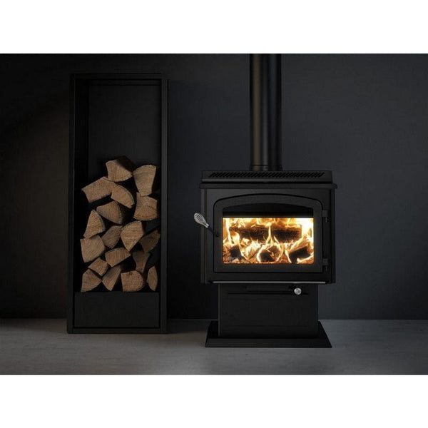 Cozy wood stove with firewood storage rack in a dark, modern room
