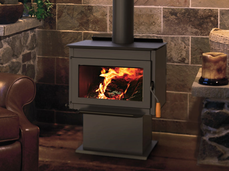 Iron Strike Tahoma 1600 Wood Stove burning in a stone hearth room