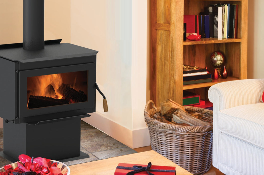 Iron Strike Tahoma 2100 Wood Stove on pedestal base in a living room