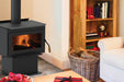 Iron Strike Tahoma 2100 Wood Stove on pedestal base in a living room