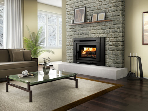 Osburn Matrix Wood Insert installed in a stone fireplace with fire burning