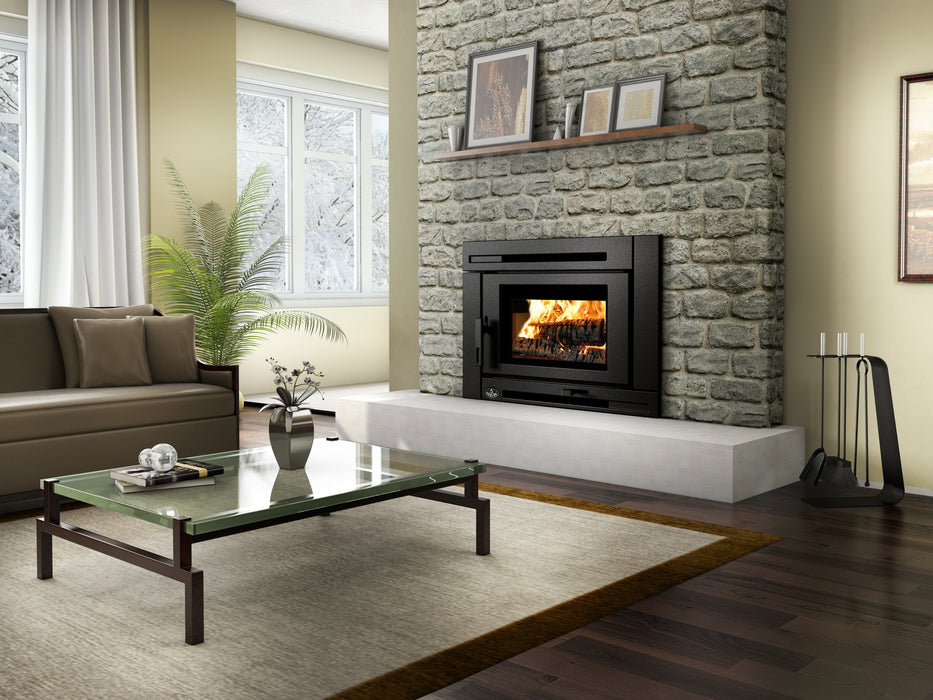 Osburn Matrix Wood Insert installed in a stone fireplace with fire burning